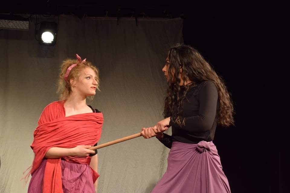 two women performing in the theatre