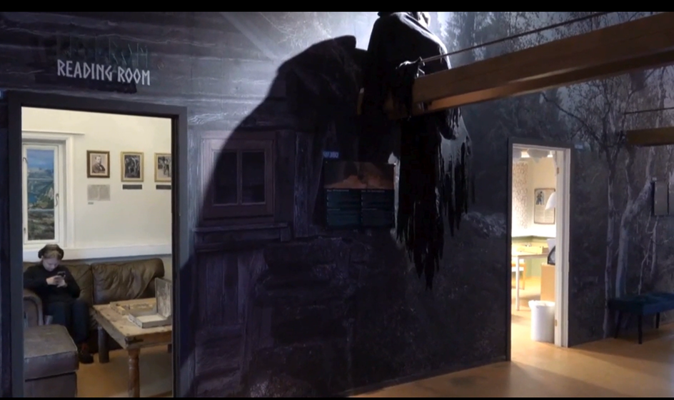 a person reading in tromso troll museum library